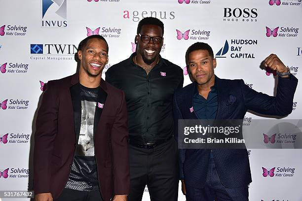 Wide receiver Victor Cruz, NFL defensive end Jason Pierre-Paul, and recording artist Maxwell attend the 7th Annual Solving Kids' Cancer Spring...