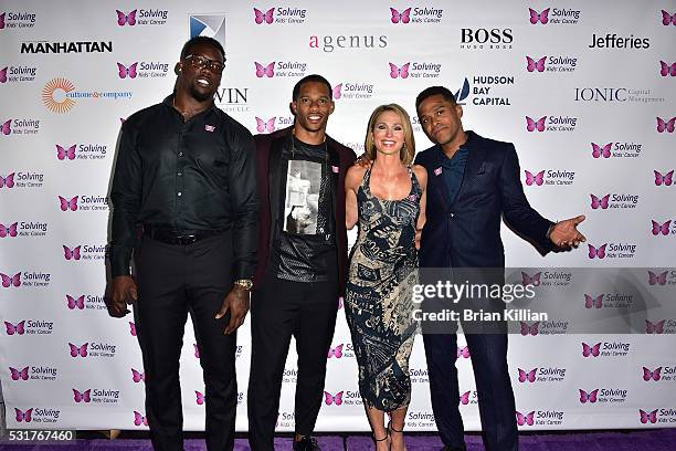 Defensive end Jason Pierre-Paul, NFL wide receiver Victor Cruz, Amy Robach, and recording artist Maxwell attend the 7th Annual Solving Kids' Cancer...