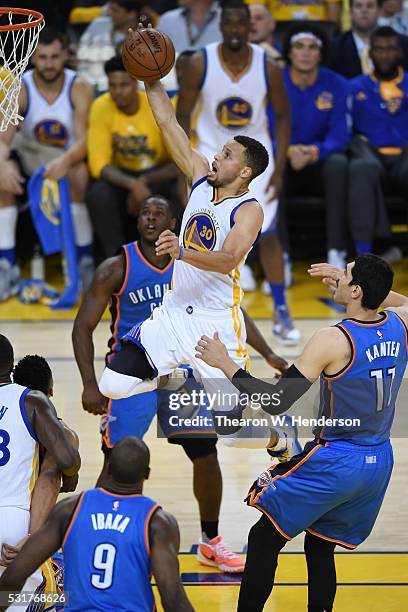 Stephen Curry of the Golden State Warriors takes the ball to the rim during game one of the NBA Western Conference Final against the Oklahoma City...