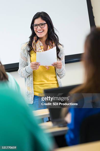intelligent student reading paper to college classmates - cute college girl stock pictures, royalty-free photos & images