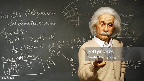 Miniature statue of Albert Einstein is seen an exhibition commemorating the 100th anniversary of the publication of late German-born physicist Albert...