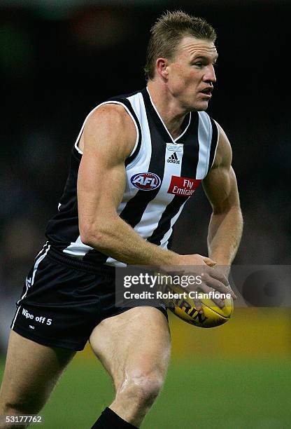 Nathan Buckley of the Magpies in action during the round 14 AFL match between the Collingwood Magpies and Port Adelaide Power at the Telstra Dome on...