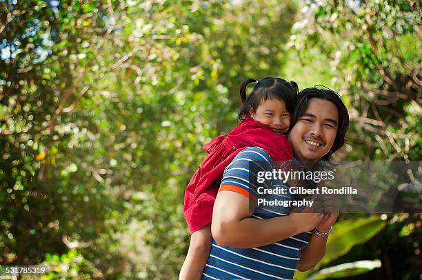 father and daughter in the park - filipino stock pictures, royalty-free photos & images