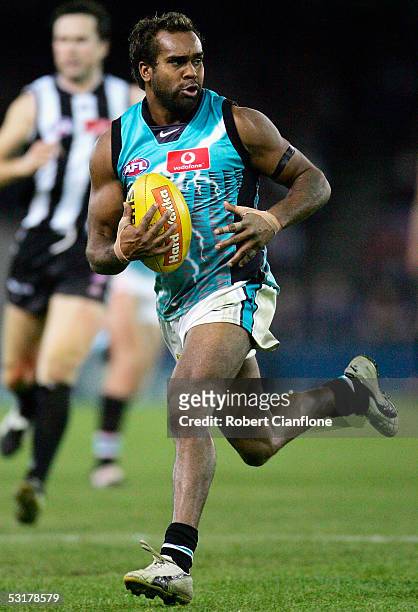 Byron Pickett of the Power in action during the round 14 AFL match between the Collingwood Magpies and Port Adelaide Power at the Telstra Dome on...