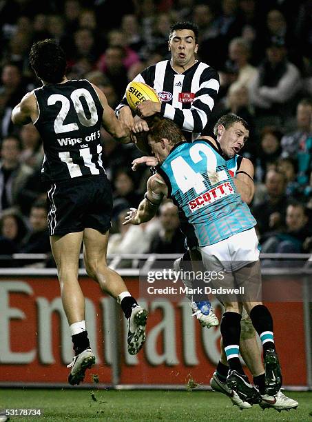 Chris Egan for the Magpies marks during the AFL Round 14 match between the Collingwood Magpies and the Port Adelaide Power at Telstra Dome July 1,...