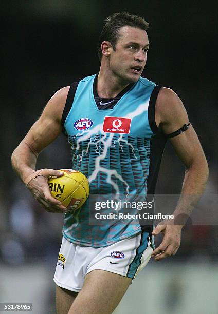 Matthew Primus of the Power in action during the round 14 AFL match between the Collingwood Magpies and Port Adelaide Power at the Telstra Dome on...