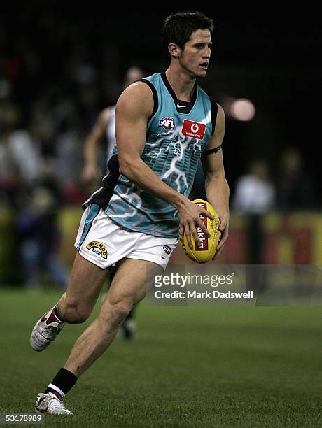 Aaron Shattock for the Power in action during the AFL Round 14 match between the Collingwood Magpies and the Port Adelaide Power at Telstra Dome July...
