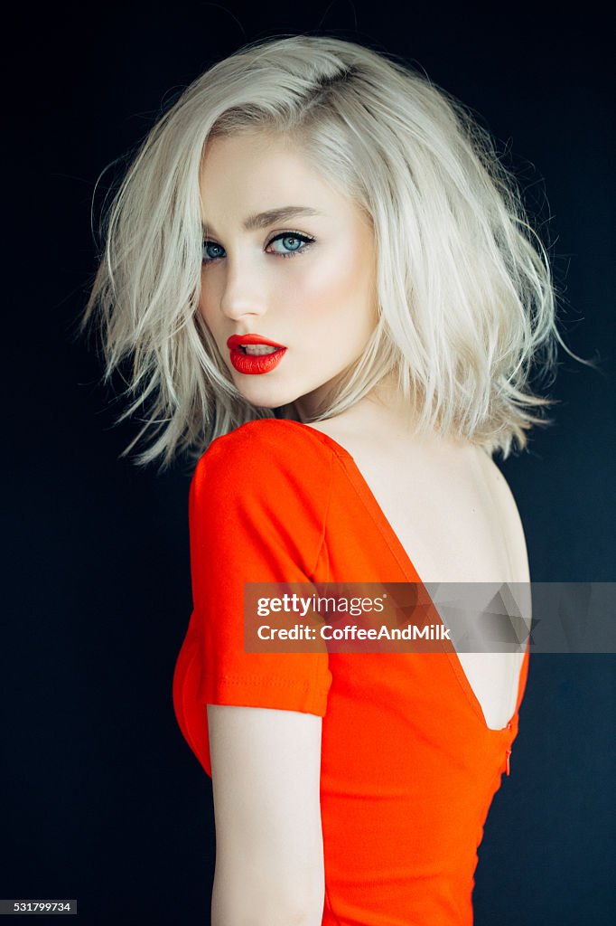 Beautiful girl on a bright red background