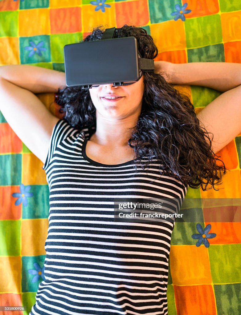 College student woman using the VR simulator at home