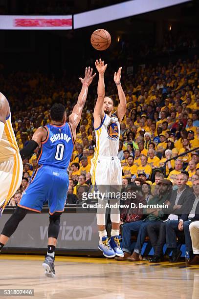 Stephen Curry of the Golden State Warriors shoots against Russell Westbrook of the Oklahoma City Thunder in Game One of the Western Conference Finals...