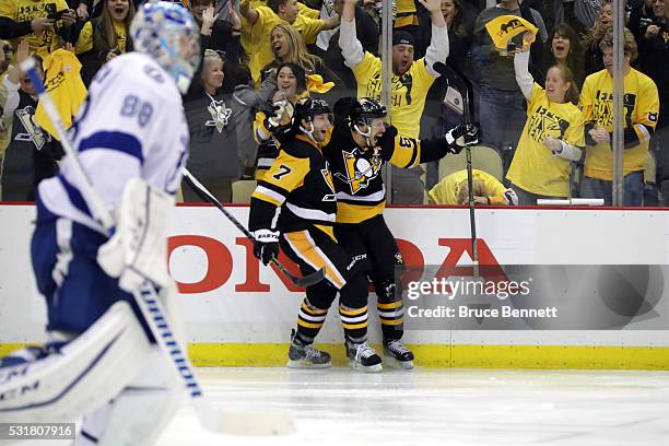 Sidney Crosby of the Pittsburgh Penguins celebrates with teammate Matt Cullen after scoring a goal in overtime against Andrei Vasilevskiy of the...