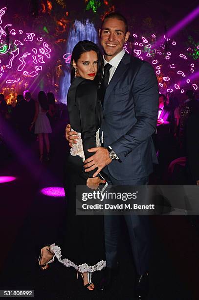 Adriana Lima and Joe Indulge attend the Chopard Wild Party during the 69th Annual Cannes Film Festival at Port Canto on May 16, 2016 in Cannes.