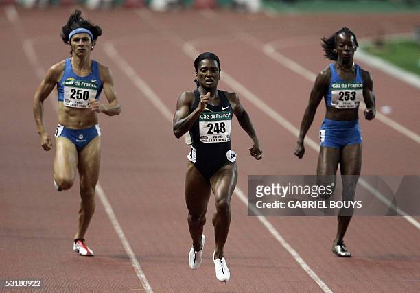 Bahamas' Tonique Williams Darling competes next to Mexican Ana Guevara and US Monique Hennagan during the women's 400m at the Golden League's Gaz de...