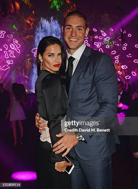 Adriana Lima and Joe Indulge attend the Chopard Wild Party during the 69th Annual Cannes Film Festival at Port Canto on May 16, 2016 in Cannes.