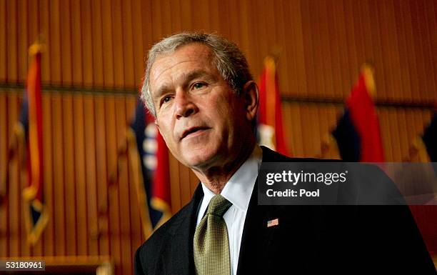 President George W. Bush talks to the media at Walter Reed Army Medical Center after visiting soldiers injured during Operation Iraqi Freedom July 1,...