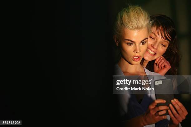 Models take a selfie as they prepare backstage ahead of the Bec & Bridge show at Mercedes-Benz Fashion Week Resort 17 Collections at Carriageworks on...