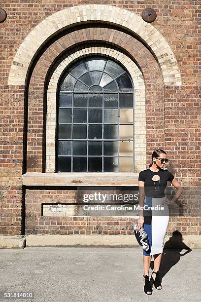 Kyly Clarke, wearing By Johnny dress, Thomas Sabo necklace, Prada shoes and McQueen handbag, arrives at the By Johnny show at Mercedes-Benz Fashion...