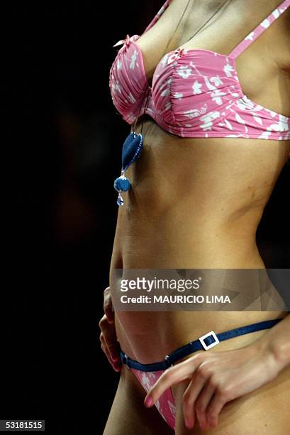 Model presents an outfit created by Agua Doce for the 2006 Spring-Summer collection, during Sao Paulo's Fashion Week, in Sao Paulo, Brazil, 01 July...