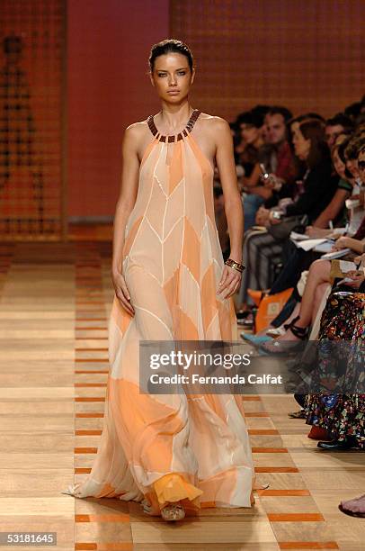 Model Adriana Lima walks down the runway at the Cori Summer 2006 fashion presentation during Sao Paulo Fashion Week July 1, 2005 in Sao Paulo, Brazil.