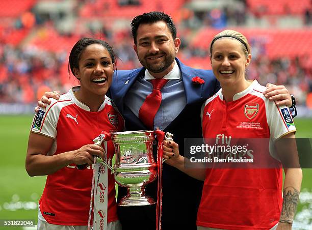 Arsenal manager Pedro Martinez Losa , Alex Scott and Kelly Smith of Arsenal celebrate with the trophy following the SSE Women's FA Cup Final between...