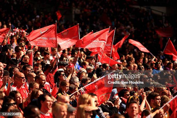 Arsenal fans wave flags during the SSE Women's FA Cup Final between Arsenal Ladies and Chelsea Ladies at Wembley Stadium on May 14, 2016 in London,...