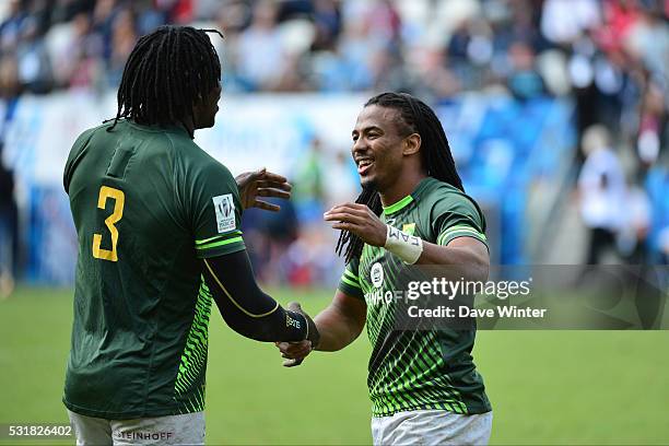Cecil Afrika and Tim Agaba of South Africa celebrate winning the Plate Final during the HSBC PARIS SEVENS tournament at Stade Jean Bouin on May 15,...