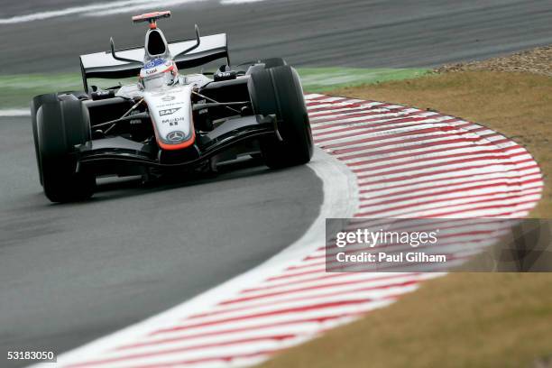 Kimi Raikkonen of Finland and McLaren Mercedes in action during the practice session prior to qualifying for the French F1 Grand Prix at the Circuit...