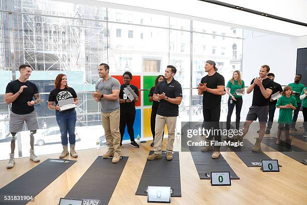 Johnny "Joey" Jones, Robyn Payne, Jose Cruz, a guest, Steve Weatherford, and Chris Ryan attend Microsoft Military Affairs and Boot Campaign's Pushups...