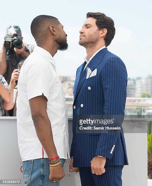 Usher and Edgar Ramirez attend the "Hands Of Stone" Photocall at the annual 69th Cannes Film Festival at Palais des Festivals on May 16, 2016 in...
