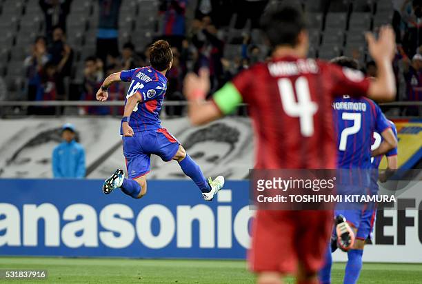 Japan's FC Tokyo midfielder Kota Mizunuma jumps to celebrate his goal during the AFC champions league round of 16 first match against China's...