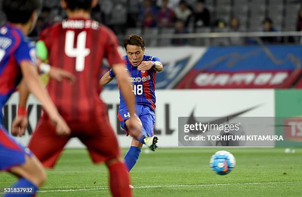 Japan's FC Tokyo midfielder Kota Mizunuma takes a free kick for goal during the AFC champions league round of 16 first match against China's Shanghai...