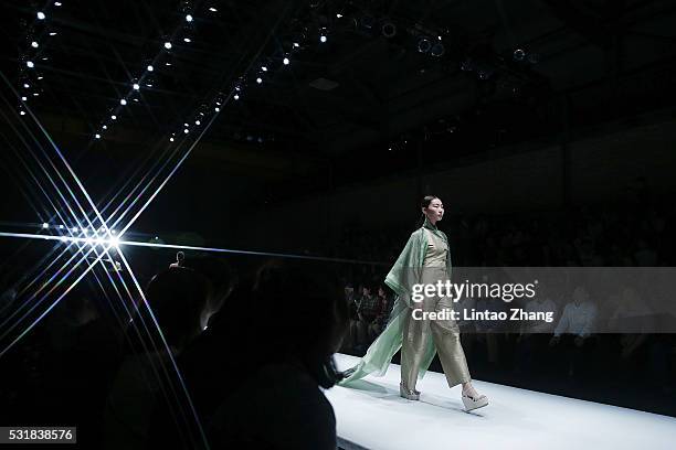 Model showcases designs on the runway at Art Institute of Beijing Union University Graduate Show during the day three of China Graduate Fashion Week...