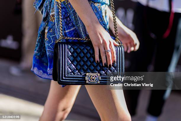 Black Chanel bag outside By Johnny at Mercedes-Benz Fashion Week Resort 17 Collections at Carriageworks on May 17, 2016 in Sydney, Australia.