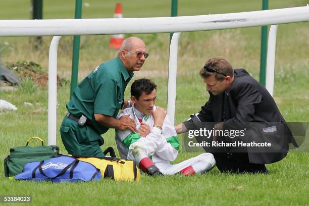 Frankie Dettori is attended to by paramedics after falling from Celtic Mill during The Laurent-Perrier Champagne Sprint Stakes at Sandown Racecourse...