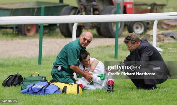 Frankie Dettori is attended to by paramedics after falling from Celtic Mill during The Laurent-Perrier Champagne Sprint Stakes at Sandown Racecourse...