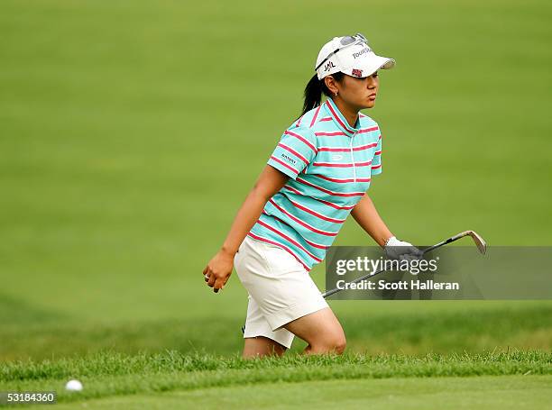 Ai Miyazato of Japan walks out of a bunker on the seventh hole during her match with Sophie Gustafson of Sweden during the third round of the HSBC...