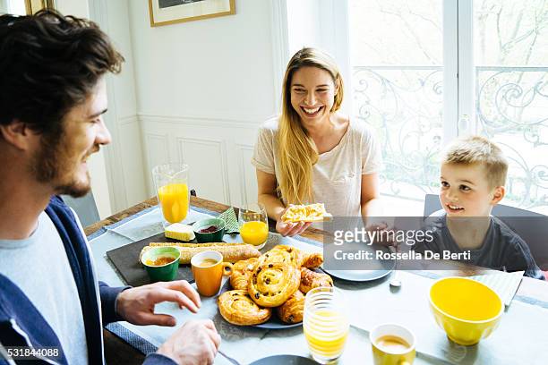 happy family having breakfast together at home - brioche stock pictures, royalty-free photos & images