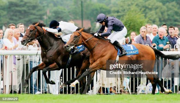 Kieren Fallon on Oratorio on his way to victory, goes past Johnny Murtagh on Motivator during The Coral-Eclipse Stakes at Sandown Racecourse on July...