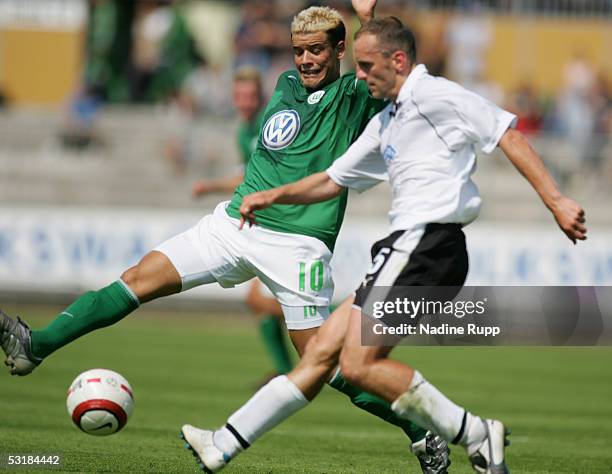 Andres DAlessandro of Wolfsburg competes with Adam Ledwon of Graz during the UI Cup match between VfL Wolfsburg and Sturm Graz on July 2, 2005 in...