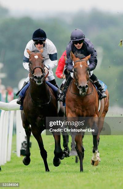 Kieren Fallon on Oratorio on his way to victory, goes past Johnny Murtagh on Motivator during The Coral-Eclipse Stakes at Sandown Racecourse on July...