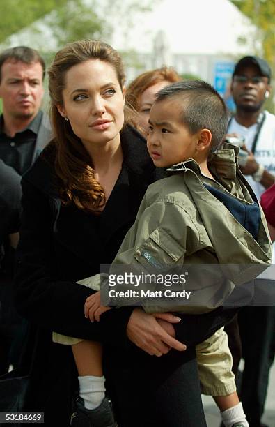 Angelina Jolie and son Maddox walk around during Live 8, Africa Calling, hosted by musician Peter Gabriel, at The Eden Project on July 2, 2005 in St....