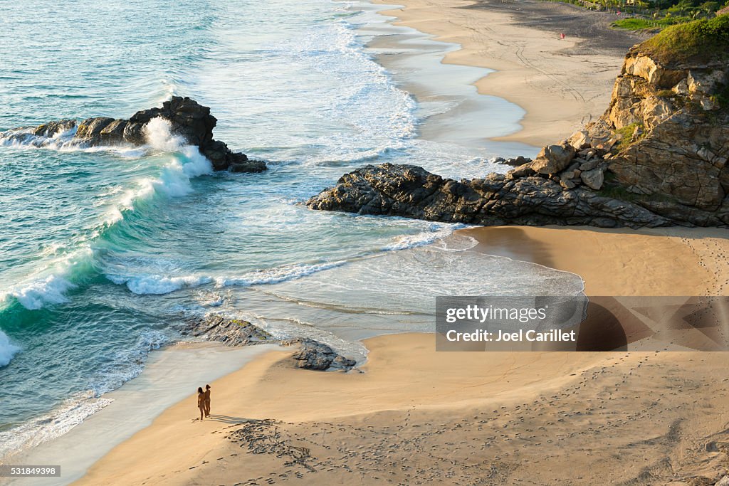 Couple on beach in Mazunte, Mexico