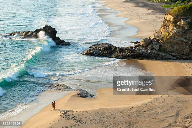 couple on beach in mazunte, mexico - oaxaca stock pictures, royalty-free photos & images