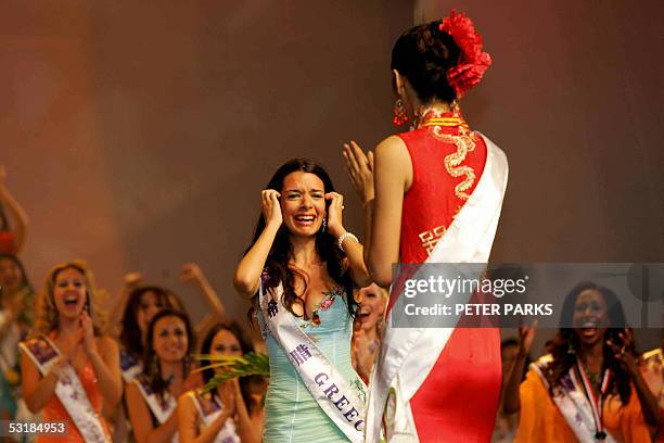 Miss Greece Nikoletta Ralli reacts after being announced Miss Tourism Queen International 2005 as Miss China Sun Jia looks at her at the World Finals...
