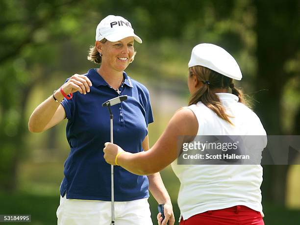 Wendy Ward greets Christina Kim on the 18th green after defeating Kim 1up during the third round of the HSBC World Match Play at Hamilton Farm Golf...