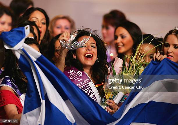 Miss Greece Nikoletta Ralli celebrates with a Grecian national flag after winning the Miss Tourism Queen International 2005 Final on July 2, 2005 in...