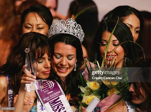 Miss Greece Nikoletta Ralli celebrates with other contestants after winning the Miss Tourism Queen International 2005 Final on July 2, 2005 in...