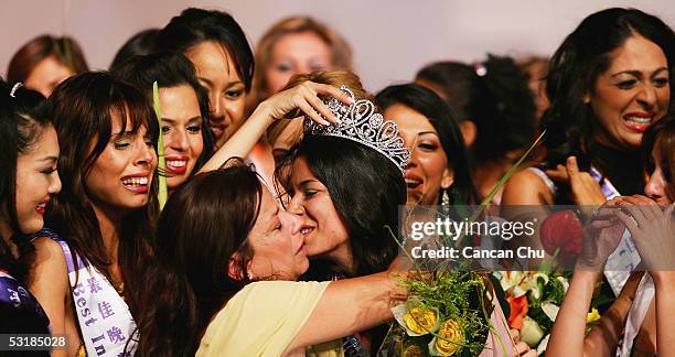 Miss Greece Nikoletta Ralli celebrates with her mother and other contestants after winning the Miss Tourism Queen International 2005 Final on July 2,...