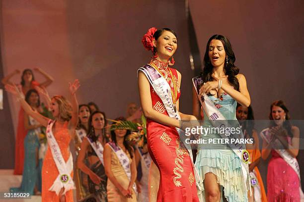 Miss Greece Nikoletta Ralli reacts after being announced Miss Tourism Queen International 2005 as Miss China Sun Jia looks on at the World Finals in...