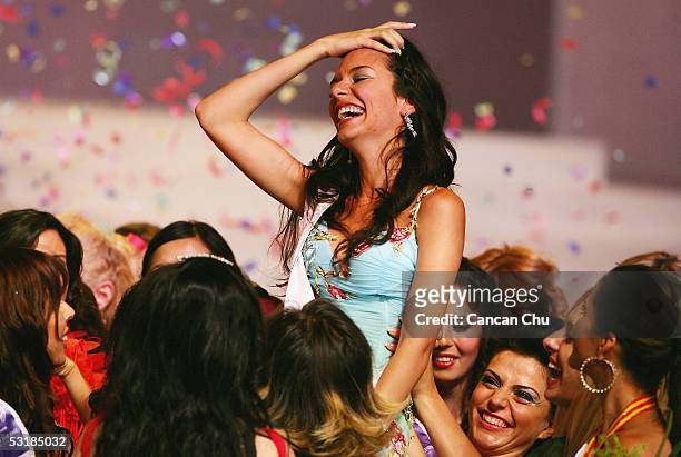 Miss Greece Nikoletta Ralli is lifted by other contestants after winning the Miss Tourism Queen International 2005 Final on July 2, 2005 in Hangzhou,...
